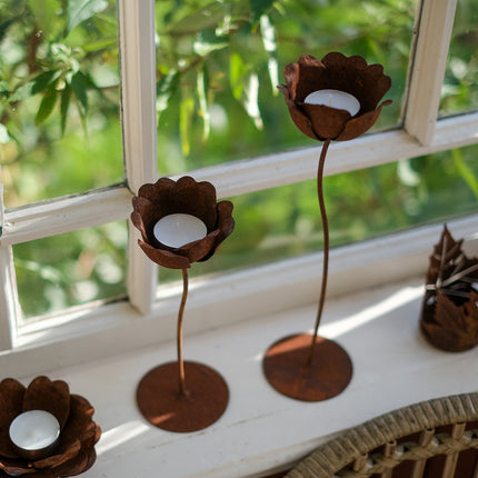 Rostig värmeljusstake vallmo