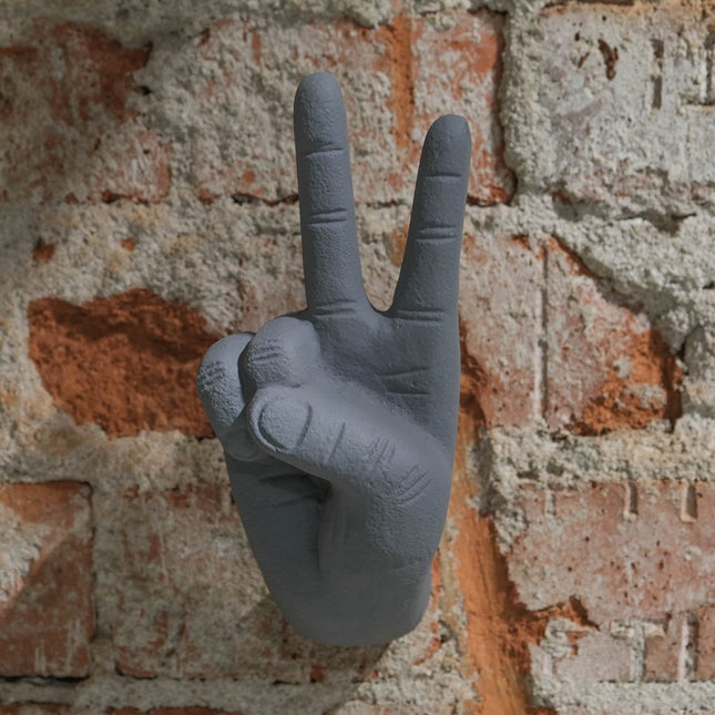 Vägghängd hand peace