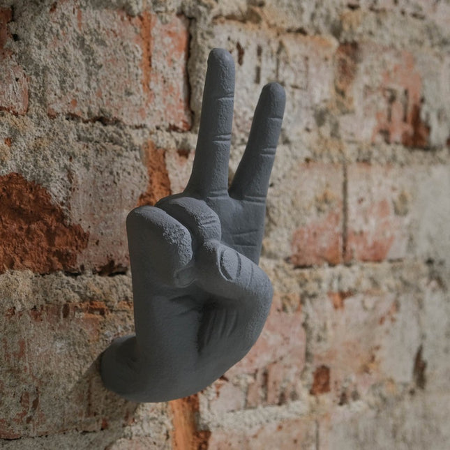 Vägghängd hand peace