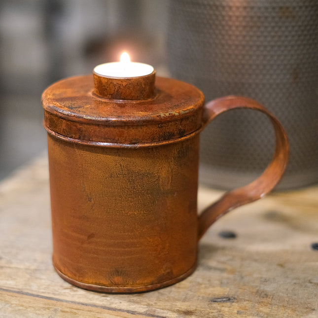 Rostig burk värmeljus